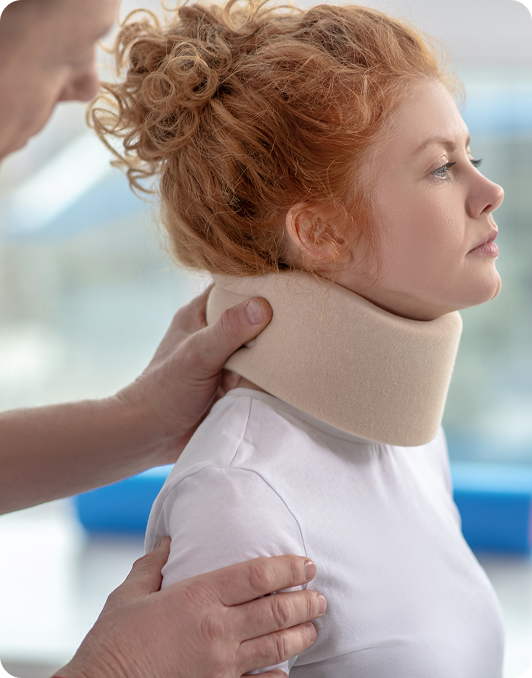 Clinician fitting a cervical collar on a woman's neck